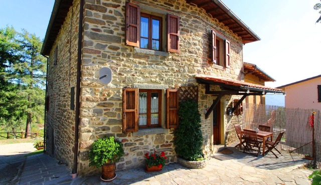 Part of an old stone country house enjoying a splendid panoramic view over the woods of the Casentin