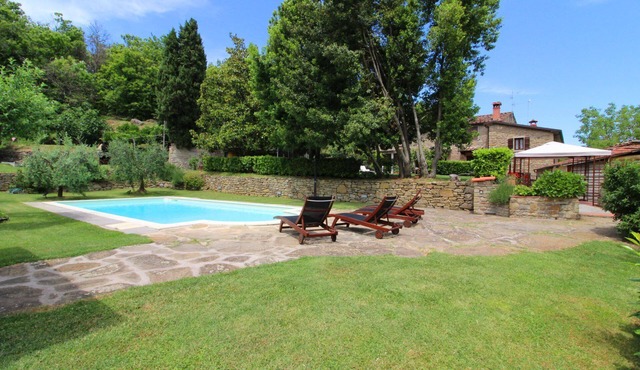 Portion of an old stone country house, well-kept garden and private swimming pool. Situated a few km