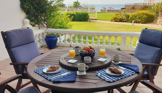Spacious 2 bed, 2 bath frontline beach house. Sea & pool views metres from sea