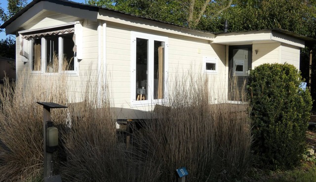 Spacious chalet for rent with nice view over the grounds against forest