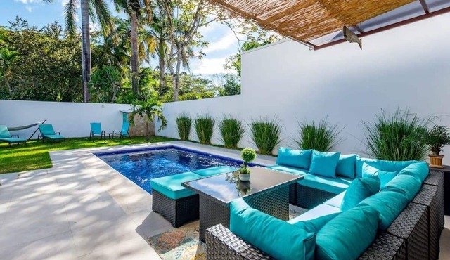 Ultramodern Townhome with an Inviting Coastal Design and Lush Outdoor Oasis with a Private Pool