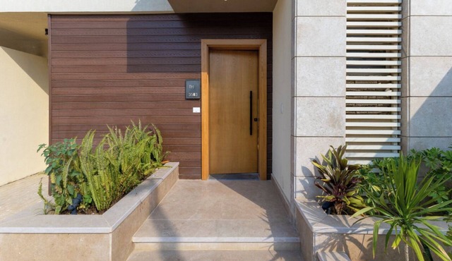villa with private garden in the crown palm hills compound -sheikh zayed